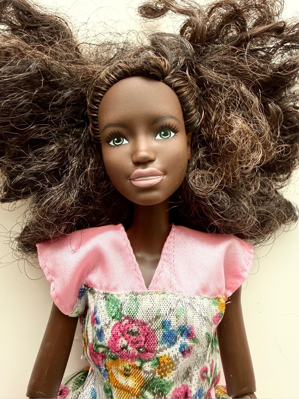 Black Barbie wearing Pink Dress